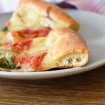 A close up of the cooked pizza crust.