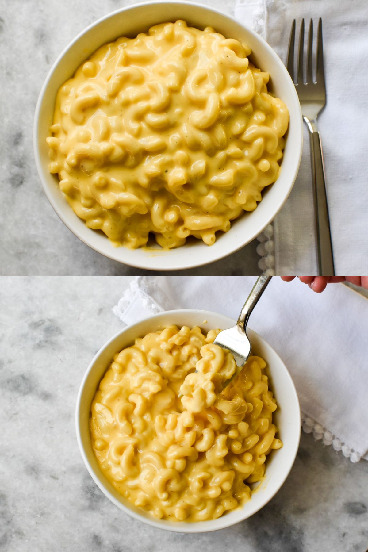 Two white bowls of creamy mac and cheese. One has a fork next to it and the other has a fork scooping the mac and cheese.