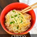 Ramen in a red bowl with cheese and green onions on top and chopsticks and the text: Cheesy ramen noodles.