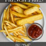 French fries on a plate with the text: reheat french fries in the air fryer.