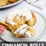 A fork with a piece of cinnamon roll on it, cinnamon rolls in the background and the text: cinnamon rolls without eggs.