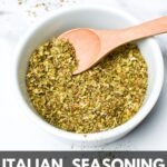 Homemade Italian seasoning mix in a small white bowl and wooden spoon with the text: Italian seasoning substitute.