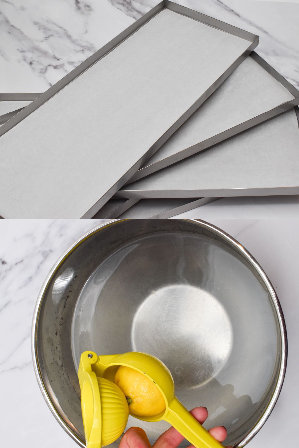 Metal trays with parchment paper on them and a metal bowl of water with a lemon being squeezed above it.