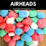 A pile of freeze dried Airheads on a wooden board with the text: how to make freeze dried Airheads.