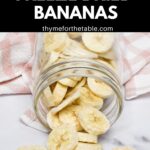 A glass mason jar laying on it's side with freeze dried bananas spilling onto the counter with the text: how to make freeze dried bananas.
